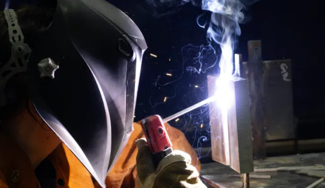 Welders welding